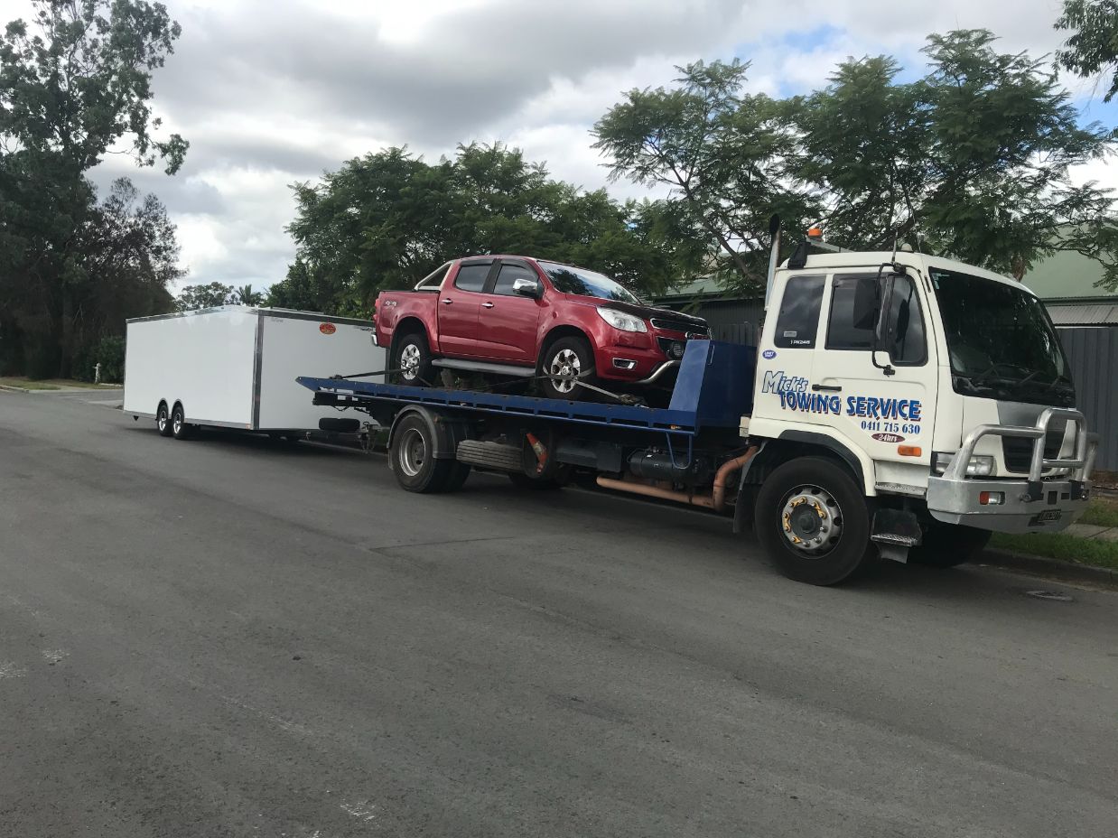 Nissan UD Pk245 Tilt Tray — Tow Truck Provider in the Gold Coast