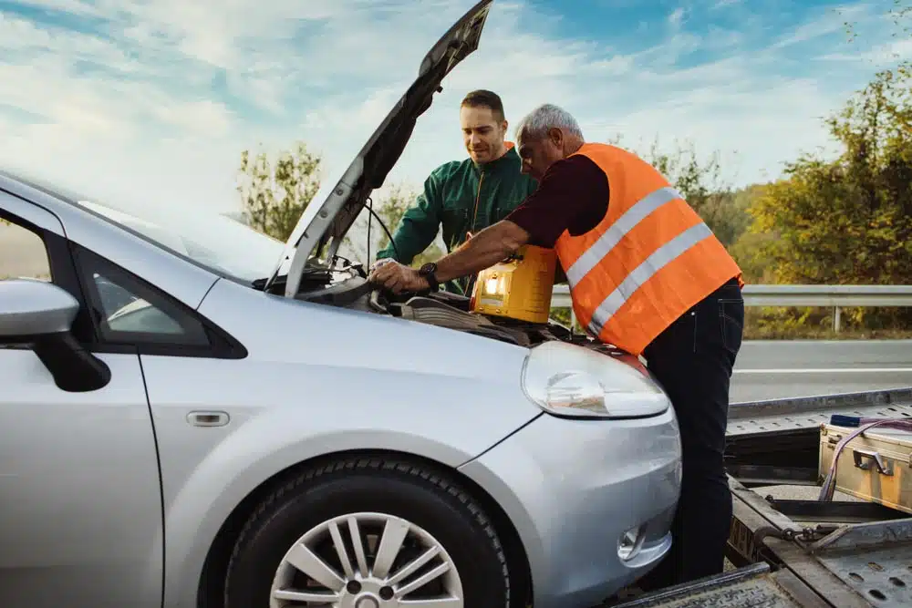 Man Trying To Fix Car By The Road