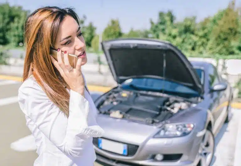 Woman Calling For Assistance Due To Car Breakdown