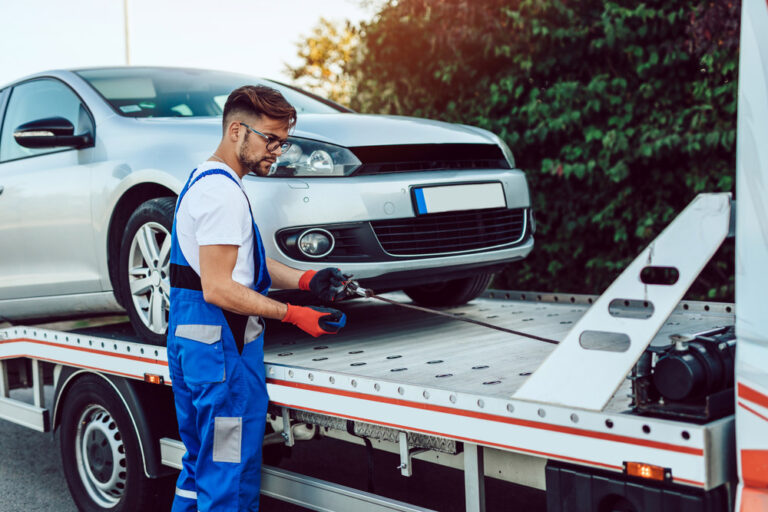 Man Towing A Vehicle