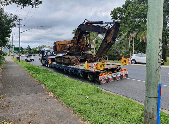 Tow Truck Carrying Heavy machinery— Tow Truck Provider in the Gold Coast