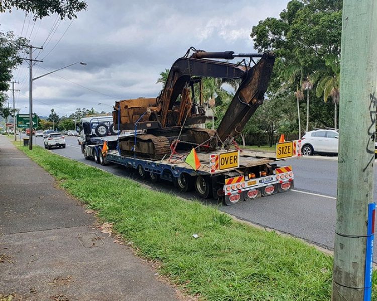 Tow Truck Carrying Heavy machinery