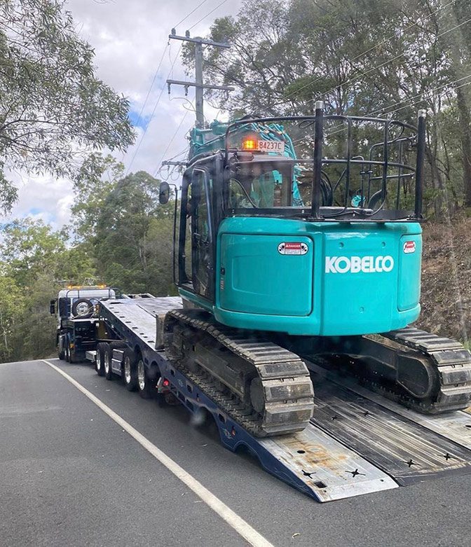 Machinery Loading on Truck — Tow Truck Provider in the Gold Coast
