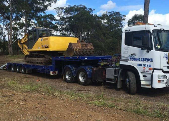 Tractor on The Back of Truck — Tow Truck Provider in the Gold Coast