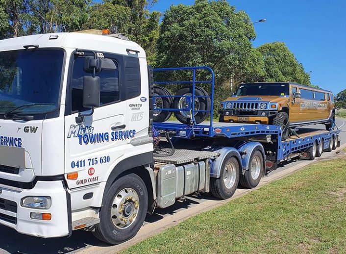 Tow Truck with Vehicle on The Back — Tow Truck Provider in the Gold Coast