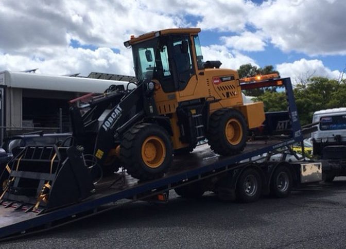 Tractor Unloading — Tow Truck Provider in the Gold Coast